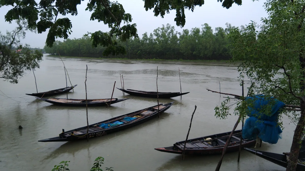 Boats anchored in the river during high tide