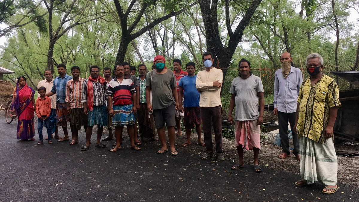Men gathered after plantation work