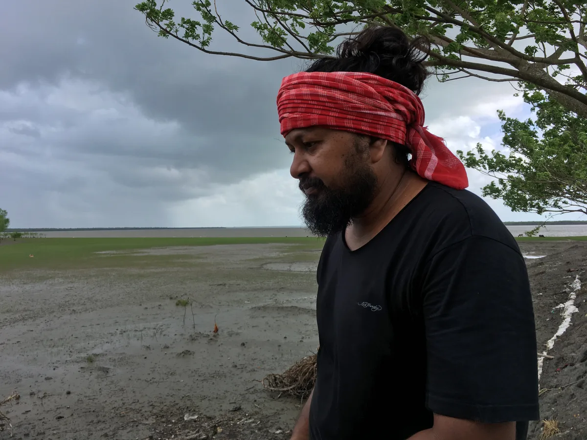 Saurav Moni working at a mangrove plantation site